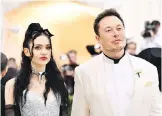  ?? THE ASSOCIATED PRESS ?? Elon Musk, right, described his evening with Grimes as a “date night.”