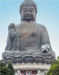  ??  ?? You can find the 34-metre, 230-tonne Tian Tan Buddha, or Giant Buddha, on Lantau Island by taking a cable-car ride.