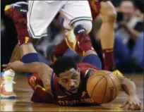  ?? MICHAEL DWYER — THE ASSOCIATED PRESS ?? Tristan Thompson dives for the ball during the first half against the Celtics on May 13 in Boston.