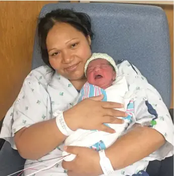  ?? PROVIDED PHOTO ?? Guadalupe Lara holds Samantha, born Wednesday on the No. 9 Ashland bus as Lara and her husband, Eduarco Centeno, were on their way to the hospital.