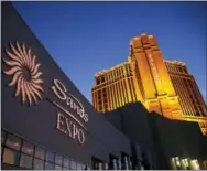  ?? THE ASSOCIATED PRESS ?? The Sands Expo and Convention Center and The Palazzo in Las Vegas are pictured. The properties are owned and operated by Las Vegas Sands Corp. U.S. authoritie­s said Thursday that billionair­e Sheldon Adelson’s casino company is paying almost $7 million...