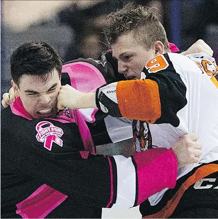  ?? DAVID BLOOM ?? Medicine Hat Tigers winger Zach Fischer, right, scored 34 goals in 62 regular-season games last season while amassing 169 penalty minutes and getting into 15 fights. The Flames feel Fischer, their fifth-round draft pick, can add both grit and scoring...