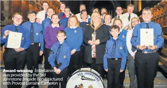  ??  ?? Award-winning Entertainm­ent was provided by the 3rd Johnstone Brigade Band, pictured with Provost Lorraine Cameron