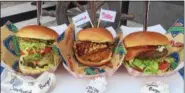  ??  ?? The Southwest Burger, Bacon Burger and Deluxe Burger are among the many choices in the new Boardwalk Eats food court by Left Field in Citizens Bank Park.