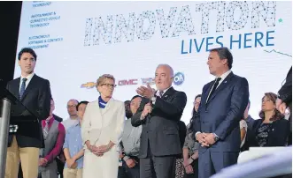  ?? PHOTOS COURTESY GM CANADA ?? Steve Carlisle (centre), president and managing director of General Motors of Canada, addresses an audience in Oshawa, Ont., in June, flanked by Prime Minister Justin Trudeau, from left, Ontario Premier Kathleen Wynne and Mark Reuss, GM executive...