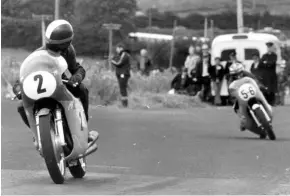  ??  ?? Below: Agostini looks back at Ginger Molloy on his Kawasaki H1R in the 1970 500cc Ulster GP. The Kiwi privateer’s twostroke triple was the forerunner of a changing of the guard in GP racing