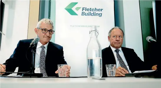 ?? PHOTO: DAVID WHITE/STUFF ?? Fletcher Building incoming chief executive Ross Taylor, left, and outgoing chairman Sir Ralph Norris fronted a media conference over the company’s mounting losses in February.