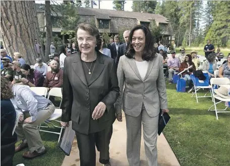  ?? Rich Pedroncell­i Associated Press ?? SENS. DIANNE Feinstein and Kamala Harris, right, attend a summit of federal, state and local leaders last week in South Lake Tahoe.