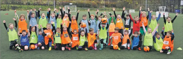  ??  ?? More than 60 youngsters from primary one to primary seven took part in the Oban training camp, coached by David McArthur, Thomas McCulloch, Colin Carswell, David Paterson and Argyll and Bute Council football developmen­t officer Martin Rae.