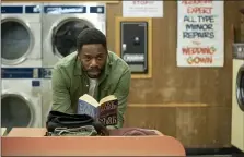  ?? UNIVERSAL PICTURES ?? Colman Domingo appears in a scene from “Candyman.” The book he’s reading is a nod to the original “Candyman” being based on a Clive Barker short story, “The Forbidden.”