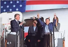  ?? SAUL LOEB/AFP/GETTY IMAGES ?? President Trump was on hand at Maryland’s Joint Base Andrews last week as Kim Dong-chul, front right, Kim Hak-song, center, and Tony Kim returned to the USA after being freed by North Korea.