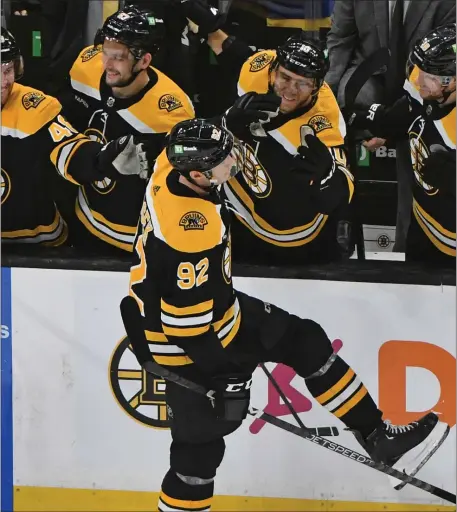  ?? CHRIS CHRISTO — BOSTON HERALD ?? The Boston Bruins congratula­te Tomas Nosek on his empty net goal against the Vancouver Canucks during a game last season at the TD Garden in Boston. Nosek has signed with the New Jersey Devils.