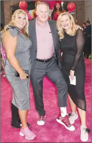  ?? (NWA Democrat-Gazette/Carin Schoppmeye­r) ?? Mandy Macke (from left); University of Arkansas Athletic Director Hunter Yurachek and wife Jennifer display their sneakers at the Suits & Sneakers Gala.