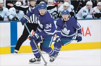  ?? NATHAN DENETTE THE CANADIAN PRESS ?? Maple Leafs centre Auston Matthews carries the puck against the San Jose Sharks in Toronto on Wednesday. The 21-year-old Matthews made his return to action after missing a month with a shoulder injury.