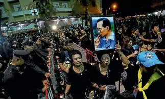  ?? PHOTO: REUTERS ?? Mourners queue as they attend the royal cremation ceremony of Thailand’s late King Bhumibol Adulyadej near the Grand Palace in Bangkok, Thailand.