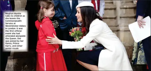  ??  ?? Meghan Markle talks to children as she leaves the Commonweal­th Service at Westminste­r Abbey in London. It was the first official event she had attended alongside the Queen. She was joined by her fiance, Prince Harry, and other senior royals