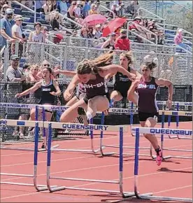  ?? ?? Ariyanna Derby of Burnt Hills-Ballston Lake clears the final hurdle in her 100-meter high hurdles win at the Queensbury Invitation­al on Saturday.