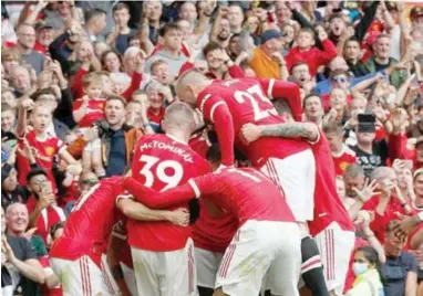  ??  ?? Manchester United players in jubilant mood after defeating Leeds United at the Old Trafford yesterday