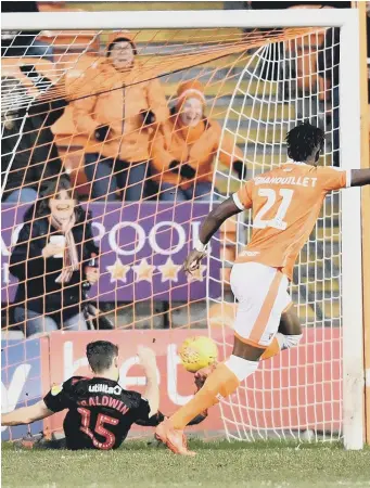  ??  ?? Jack Baldwin clears off the line against Blackpool.