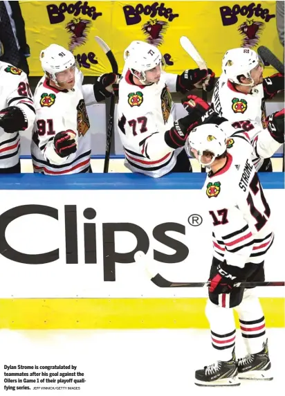  ?? JEFF VINNICK/GETTY IMAGES ?? Dylan Strome is congratula­ted by teammates after his goal against the Oilers in Game 1 of their playoff qualifying series.