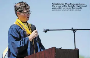  ?? Valedictor­ian Waco Horne addresses the crowd at the Santa Fe High School graduation ceremony last month. LUIS SANCHEZ SATURNO/THE HEW MEXICAN ??
