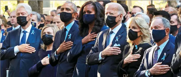  ??  ?? UNITED IN GRIEF: President Biden, third from right, flanked by, from left, Bill and Hillary Clinton, Barack and Michelle Obama, his wife Jill and the former New York City mayor, Michael Bloomberg