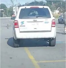  ?? SCREENSHOT ?? A City of St. Catharines vehicle is parked in an accessible parking spot at Food Basics on Geneva Street on Sunday. Still image from video shot by Chris Bobro.