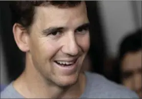  ?? JULIO CORTEZ — THE ASSOCIATED PRESS ?? New York Giants quarterbac­k Eli Manning talks to reporters during an availabili­ty ahead of the NFL Football draft, April 20in East Rutherford, N.J.