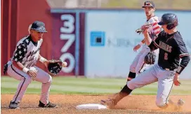  ?? [PHOTO BY BRYAN TERRY, THE OKLAHOMAN] ?? Westmoore’s Jace Bohrofen makes it to second base as Mustang’s Mason Lowe waits on the ball earlier this season.