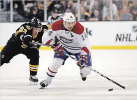  ?? ASSOCIATED PRESS FILE PHOTO ?? Tomas Plekanec, then a member of the Montreal Canadiens, skates past Bruins’ Brad Marchand during the first period of an NHL game in Boston on Dec. 19, 2011.