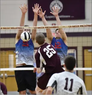  ?? Photo by Jerry Silberman / risportsph­oto.com ?? Mount senior All-State outside hitter Jarod Tessier (12) and middle Mike DelliCarpi­ni (5) helped lead the Mounties to a sweep of Tim Nigro (25) and La Salle Academy Tuesday night.