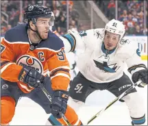  ?? JASON FRANSON — THE CANADIAN PRESS VIA AP ?? Sharks defenseman Justin Braun, right, chases Edmonton center Connor McDavid in the second period of Wednesday’s win.