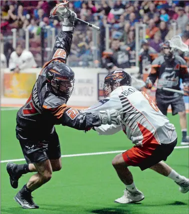  ?? DANA JENSEN/DAY FILE PHOTO ?? Kevin Buchanan, left, of the New England Black Wolves, set a personal best for a single-season in goals (25), assists (49) and points (74) last year.
