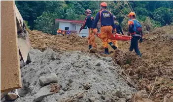  ?? — AFP photo ?? This handout photo obtained from the Facebook page of the Office of the Provincial Fire Marshal (OPFM) Davao de Oro shows responders conducting rescue operations at the site of a landslide in Maco, Davao de Oro.