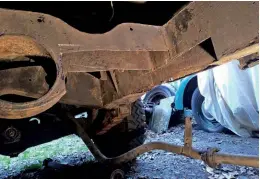  ??  ?? With the gearbox crossmembe­r removed, it was clear that the chassis was quite rusty too. This shot shows the extent of the damage once the rust had been cut out.