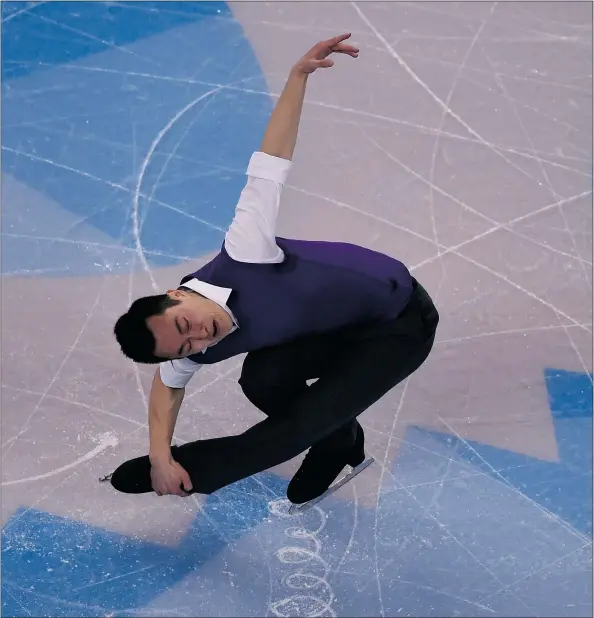  ?? — GETTY IMAGES ?? Canadian Patrick Chan skates during the men’s short program at the ISU World Figure Skating Championsh­ips at TD Garden in Boston on Wednesday. Chan sits in third place after the short program. Japan’s Yuzuru Hanyu leads the field.