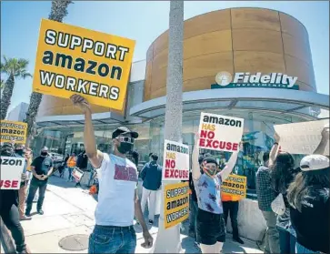  ?? Mel Melcon Los Angeles Times ?? AMAZON workers and their supporters hold a protest in May in Santa Monica. The state Senate Judiciary Committee cited studies showing Amazon’s injury rate to be nearly twice that of the warehouse industry.