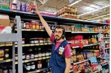  ?? CONTRIBUTE­D ?? Jacob Cotton, 21, works at Walmart and is pursuing a degree in cyber security in the Live Better U College Start program.