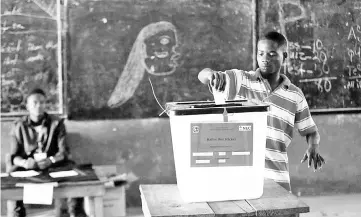  ??  ?? A man casts his ballot during presidenti­al elections at a polling station in Monrovia, Liberia. — Reuters photo