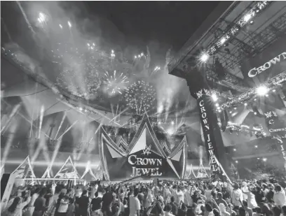  ?? AMR NABIL/AP FILE ?? Spectators watch fireworks during the WWE Crown Jewel matches in Riyadh, Saudi Arabia, in 2019. In the last 12 months shares of WWE have jumped 50%, a period when U.S. stock markets have fallen into a serious funk.