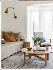  ??  ?? 5. A wall lamp from Emac & Lawton and Jardan coffee table add warmth to the living area. A vintage Parker armchair affords views through sheer curtains from Northside Blinds Awnings Curtains.