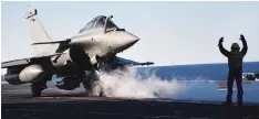  ?? PHOTO: REUTERS ?? A French Rafale fighter jet prepares to take off from the flight deck of the Charlesde-Gaulle aircraft carrier operating in the eastern Mediterran­ean Sea