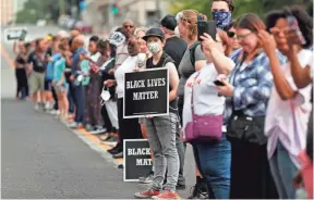  ?? PHOTOS BY JEFF ROBERSON, AP ?? Demonstrat­ors protest Sunday outside the St. Louis Police Department headquarte­rs in response to a not guilty verdict in the trial of former St. Louis police officer Jason Stockley, who was acquitted Friday in the 2011 killing of a black man following...