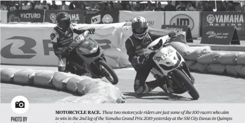  ?? PHOTO BY MARK PERANDOS ?? MOTORCYCLE RACE. These two motorcycle riders are just some of the 100 racers who aim to win in the 2nd leg of the Yamaha Grand Prix 2019 yesterday at the SM City Davao in Quimpo Boulevard, Matina, Davao City.