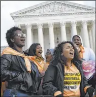  ?? Susan Walsh The Associated Press ?? People protest outside the Supreme Court in Washington on Nov. 8 over the Trump administra­tion’s plan to end legal protection­s that shield nearly 700,000 immigrants from deportatio­n.