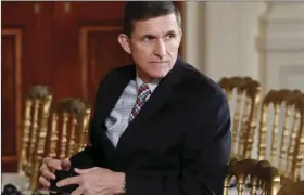  ??  ?? In this Feb. 10 file photo, then-National Security Adviser Michael Flynn sits in the East Room of the White House in Washington. A member of Donald Trump’s transition team asked national security officials in the Obama White House for the classified...