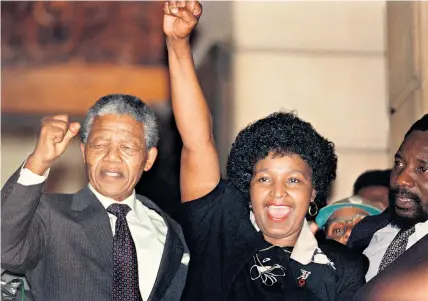  ??  ?? Winnie with Nelson Mandela after his release from 27 years in prison, February 1990. Below, celebratin­g the birth of their first child in 1961. Bottom, defiantly emerging from court (2004)