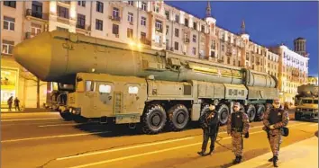  ?? Getty Images ?? THE KREMLIN on Monday announced plans for tactical nuclear exercises near Ukraine. Above, national guards patrol near a Yars missile system during rehearsals for Thursday’s Victory Day parade in Moscow.