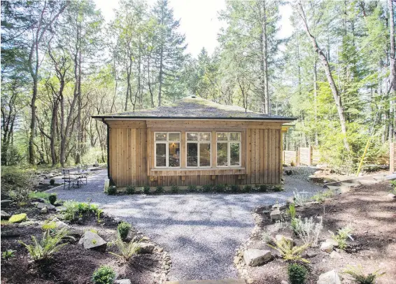  ??  ?? Most of the cottage is ringed in crushed quartz, for a satisfying crunch. The outdoor seating is nestled in an idyllic environmen­t with mossy rocks and filtered light.