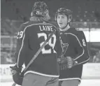  ?? ADAM CAIRNS/COLUMBUS DISPATCH ?? Blue Jackets defenseman Zach Werenski, here talking with teammate Patrik Laine on Feb. 4 against Dallas, has one goal and four assists in 13 games.